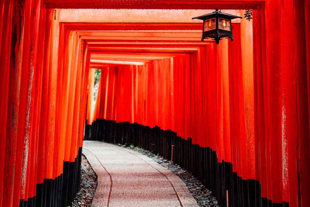 Mastering the First Impression: Your intriguing post title goes here Explore the iconic red torii gates of Fushimi Inari Shrine in Kyoto, Japan, featuring traditional architecture.